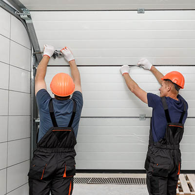 Garage door safety and maintenance - tighten hardware